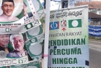 Campaign posters for Malaysia's Islamic party PAS. Photo by Edward Aspinall.