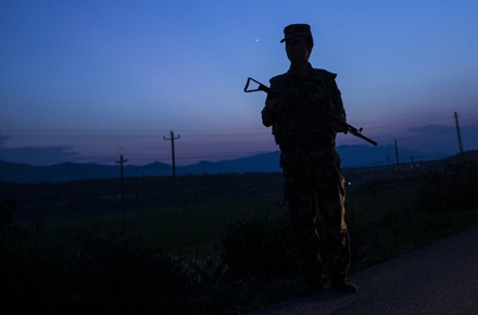A Chinese soldier patrols the border with Myanmar. Photo by AFP.
