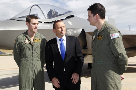 Australian Prime Minister Tony Abbott with two RAAF squadron leaders at the announcement of the purchase of 58 new F35 joint strike fighters. Photo by Department of Defence.